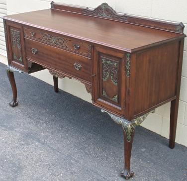 SideboardWithGreenGoldDecorationsAfterRestorationIsComplete